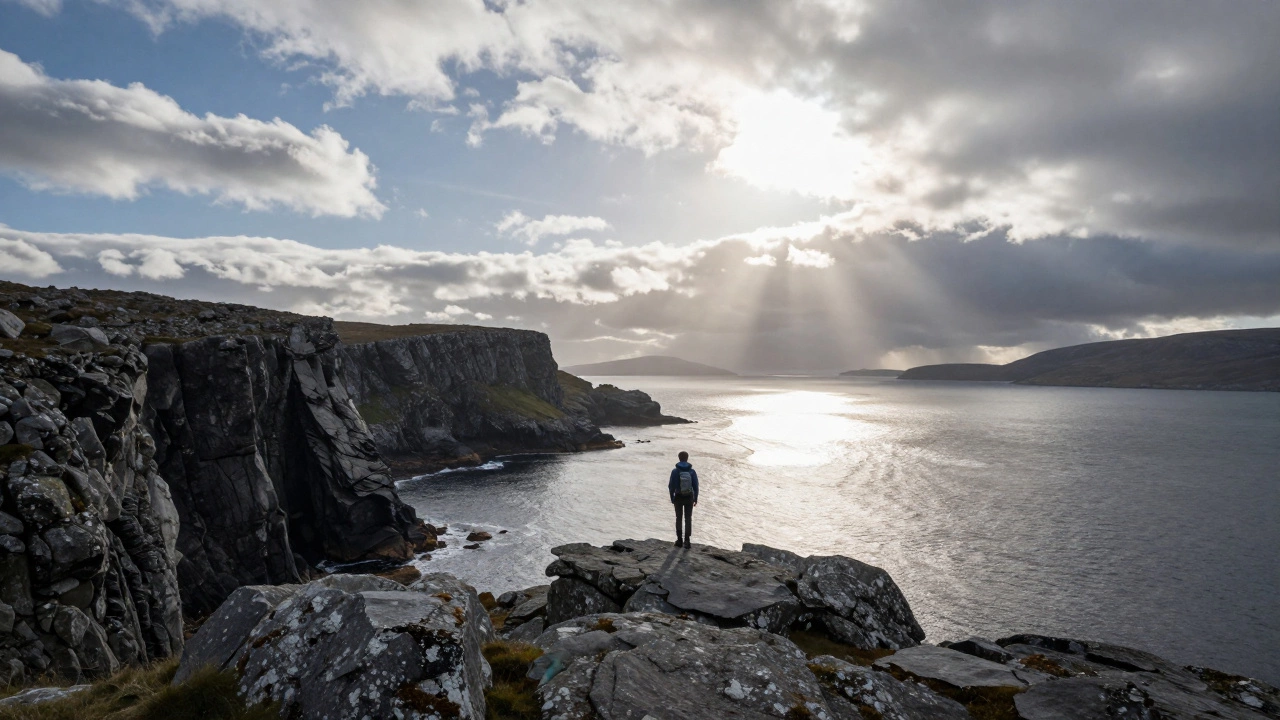 Solo traveler viewing dramatic Scottish Highland coastal cliffs